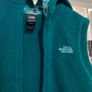 The NorthFace zip up vest with hood